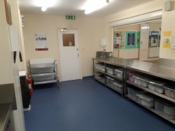 View of kitchen facing entrance.