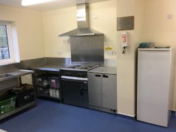 View of kitchen facing work-space.