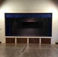 View onto stage, curtains up.